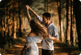 Liam and Maya embracing outdoors